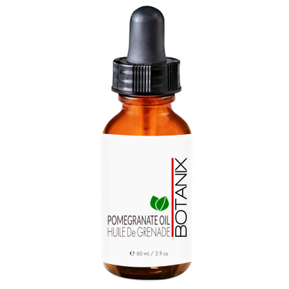 pomegranate beauty oil in amber bottle