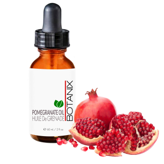 Bottle of Pomegranate Oil with dropper and pomegranate fruit