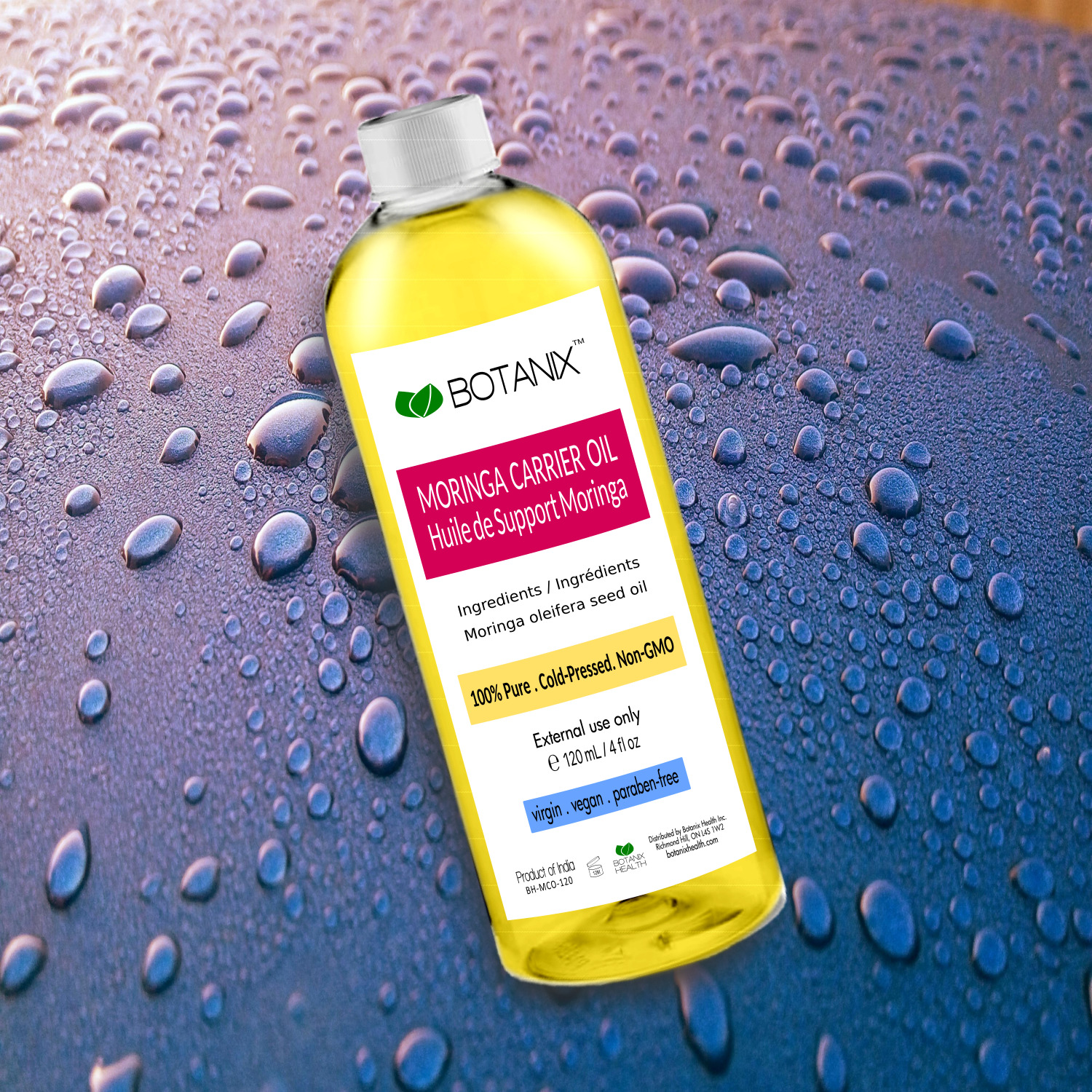 Moringa oil by Botanix with water droplets in the background